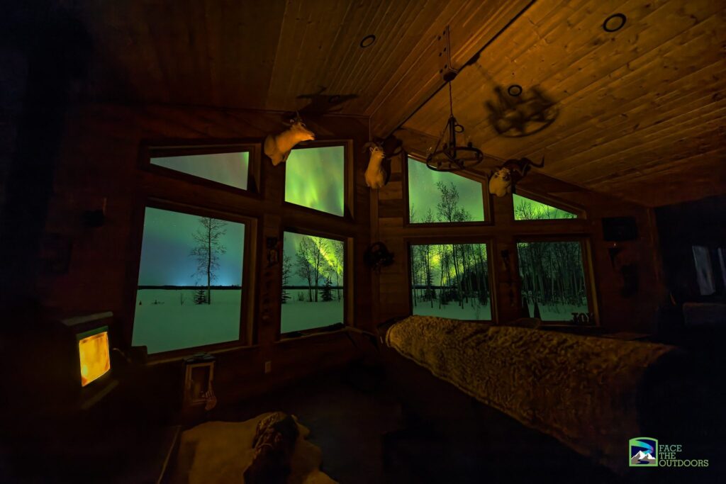 Face The Outdoors aurora viewing lodge viewing the aurora from big windows.