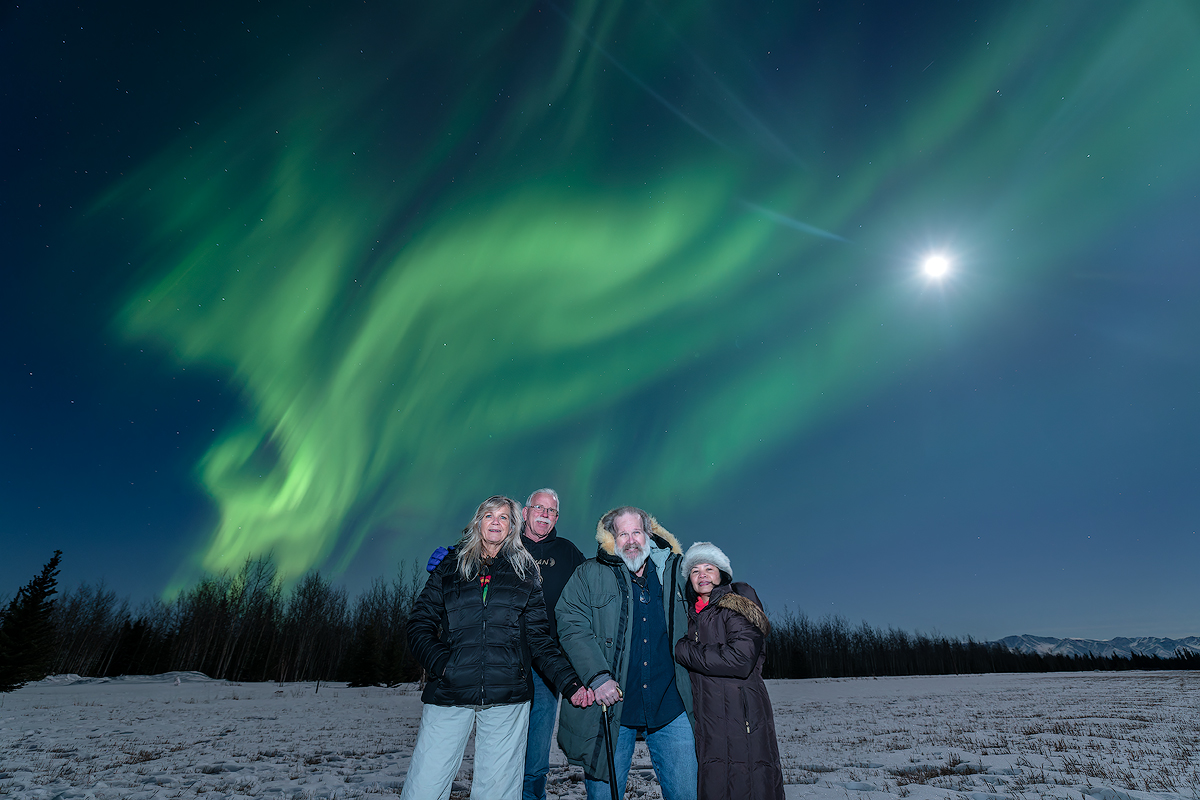 Guests viewing aurora borealis at Face The Outdoors lodge in Fairbanks Alaska