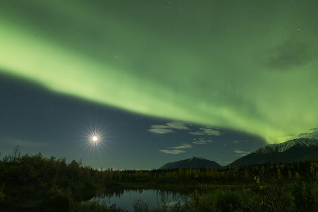 High-quality professionally captured northern lights photograph with sharp focus, proper composition, and clean post-processing over Alaska landscape