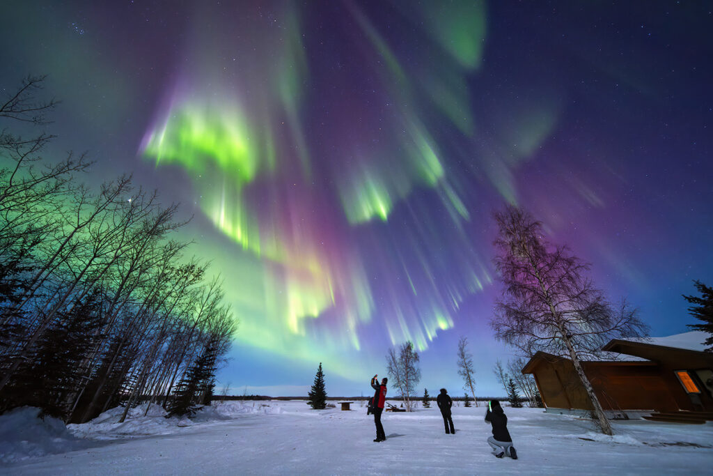 Aurora viewing chances comparison showing the difference between a faint aurora arc and a vivid overhead display based on number of nights in Fairbanks