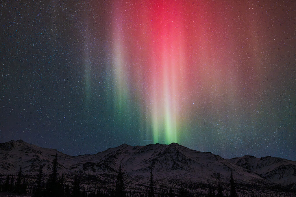 Aurora borealis over Denali National Park showing pristine wilderness northern lights viewing in Alaska