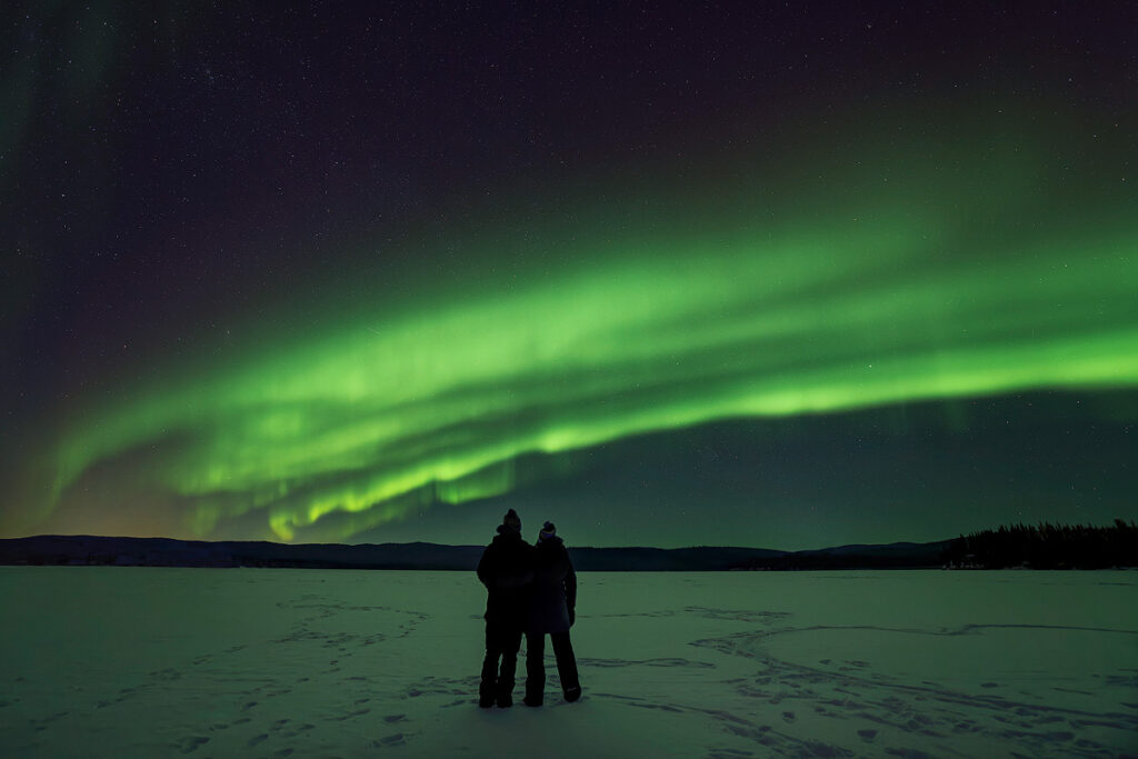 Northern lights dancing over Fairbanks Alaska showing how many nights you need to see a vivid aurora displa