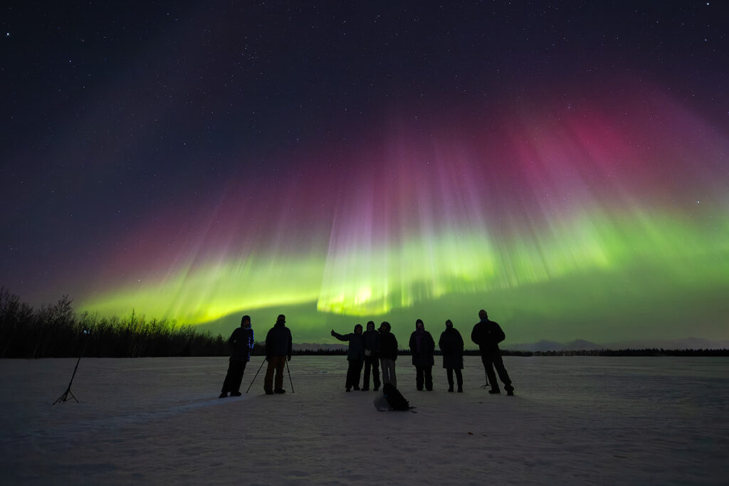 Stunning northern lights display over Face The Outdoors lodge near Fairbanks — book a small group aurora tour for the best chance to witness this
