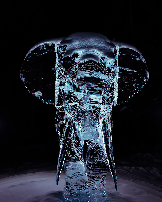 Intricately carved illuminated ice sculpture at World Ice Art Championships in Fairbanks a spectacular February and March event pairing perfectly with aurora viewing trips