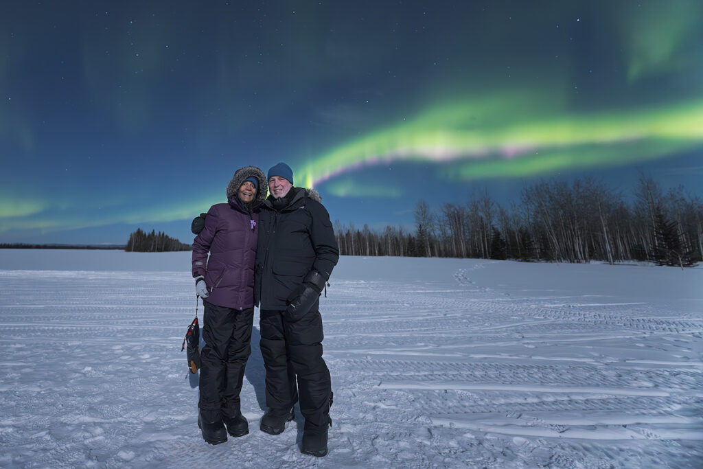 See the northern lights Fairbanks — guests experiencing the aurora borealis on a Face The Outdoors tour during northern lights season in Interior Alaska